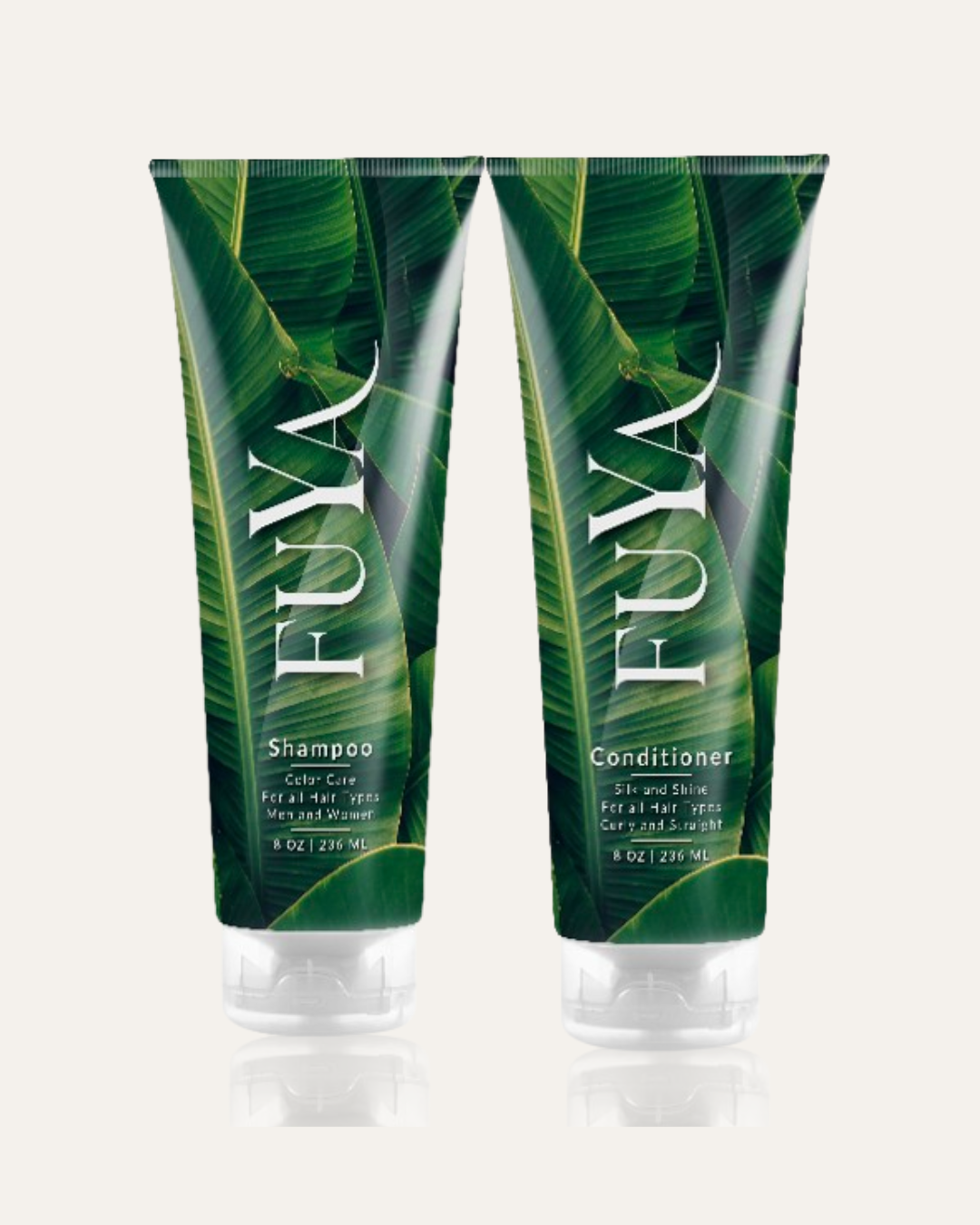 Two FUYA shampoo and conditioner bottles with leaf design on a white background