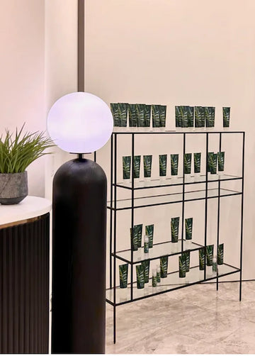 FUYA haircare display shelf at Oren Salon – clean minimalist setup with natural design and tropical-inspired packaging