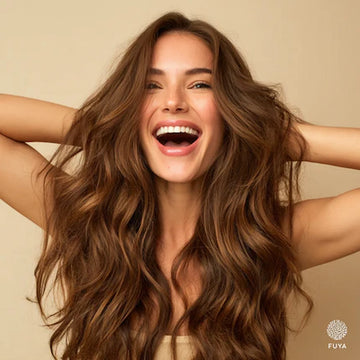 Smiling woman with soft wavy hair – FUYA salon result showing volume and shine
